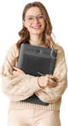 A woman in a wool jumper holding a graphics tablet