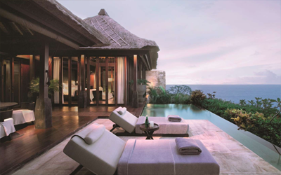 Private villas with private pools on top of the cliff overlook the Indian Ocean.