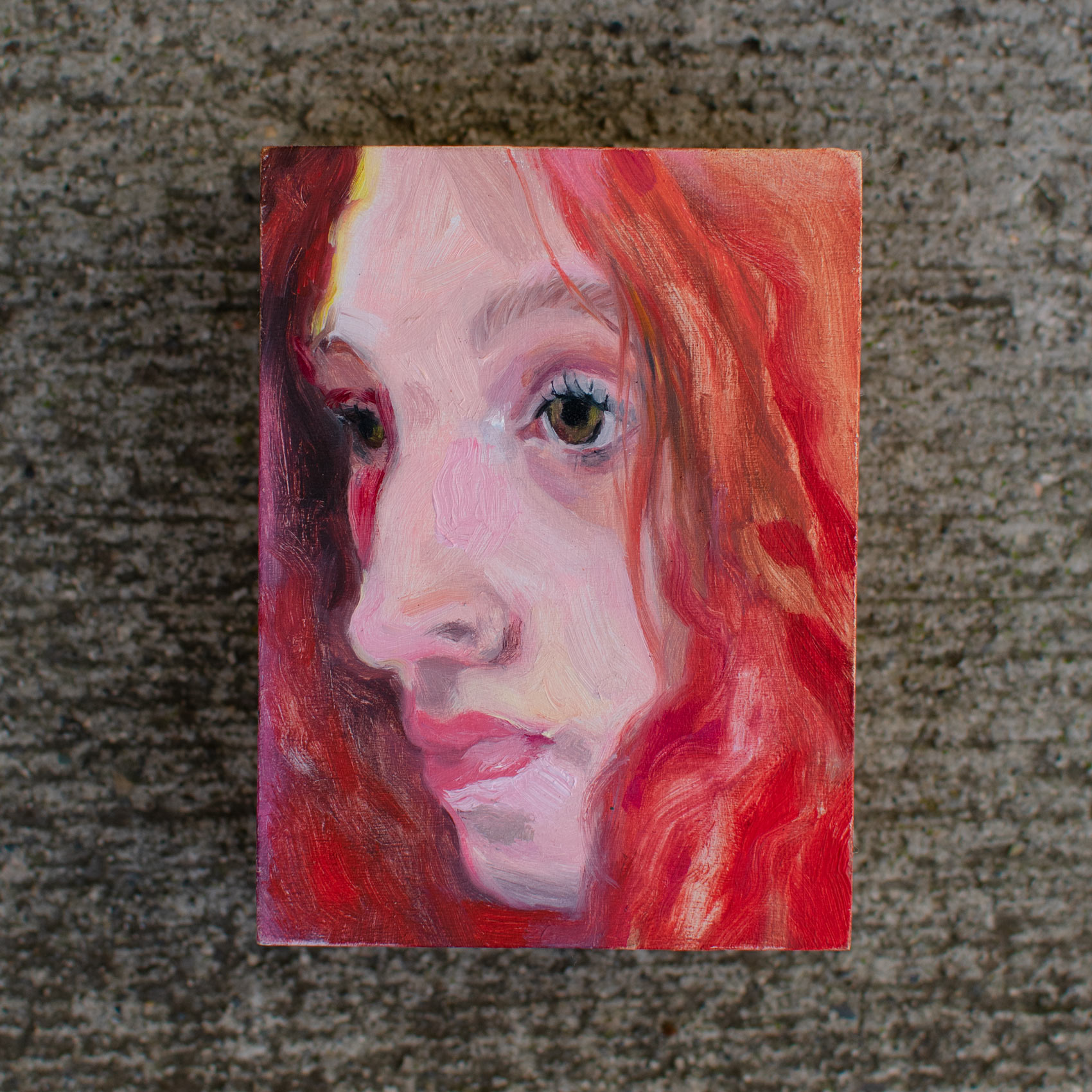 expresssive closeup portrait of a person with long red hair