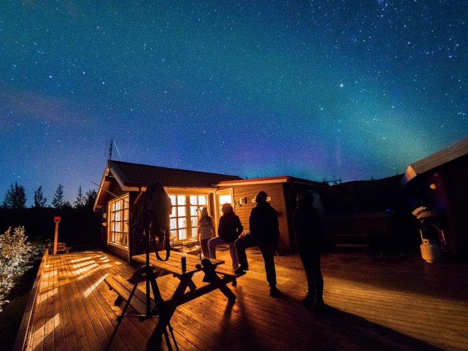 Starry sky and northern lights above the holiday home
