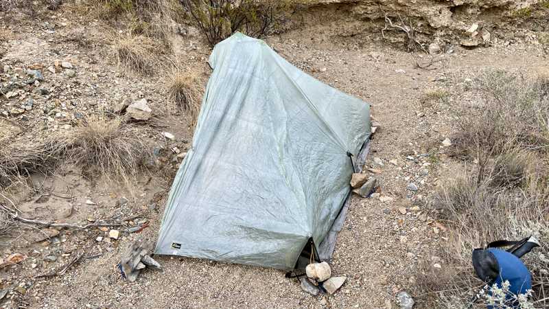 Rocks hold down Gravity's tent