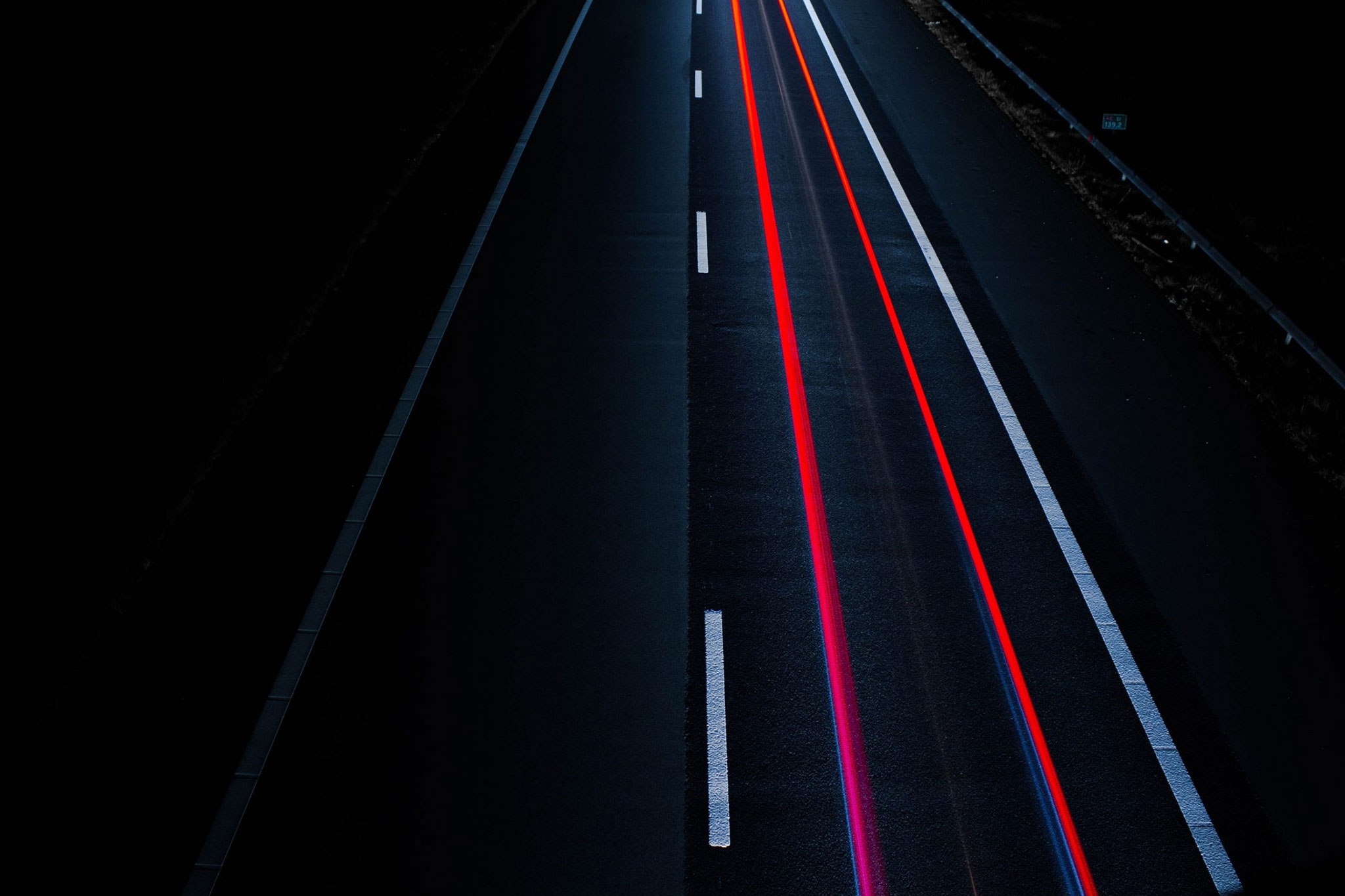 Long-exposure of brake lights on road