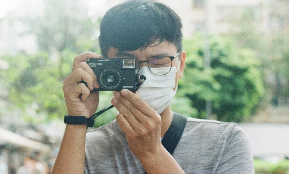 Someone taking photo of me holding up my Agfa Optima 1535