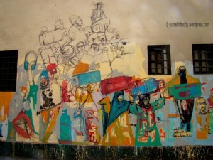 [In between the pharaonic murals and the martyrs’ murals, Hanaa al-Degham created this beautiful, still unfinished mural. The theme of gas cylinders is highly relevant given the constant reoccurrence of gas shortages in Egypt.]