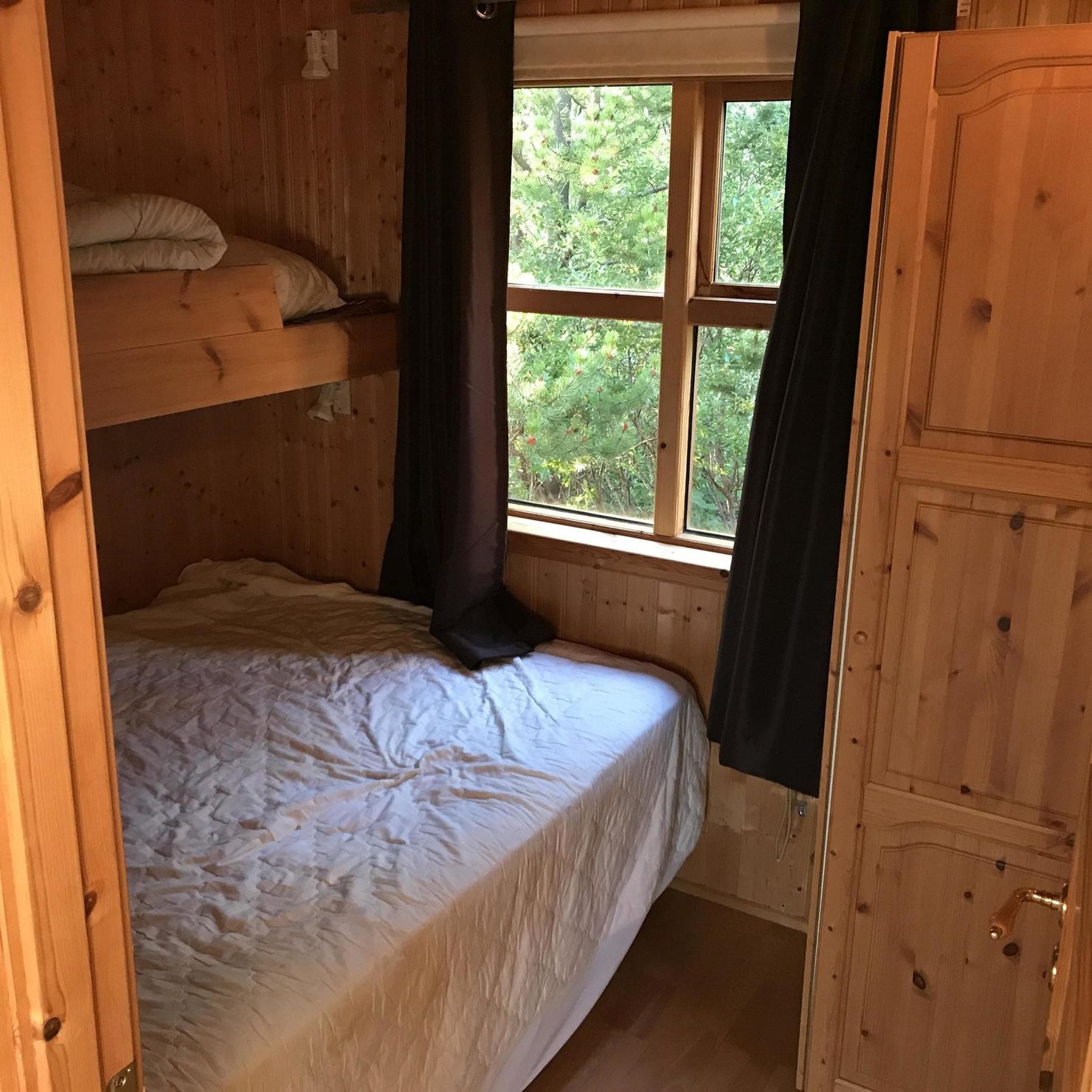 Bedroom with bunk bed and window