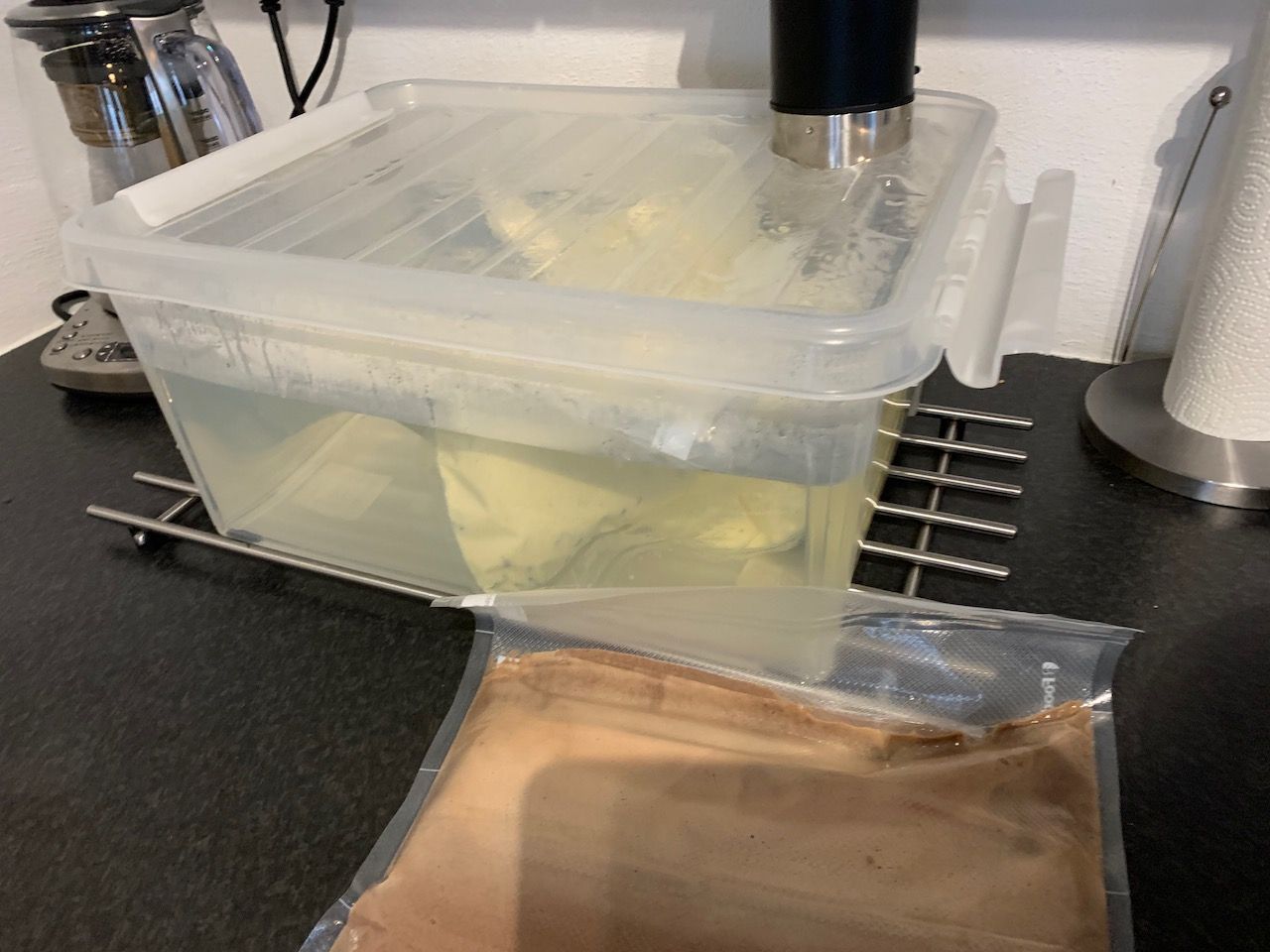 Multiple bags of ice cream mixture in a sous vide container. As heating in a water bath is consistent, you can make large batches at a time.