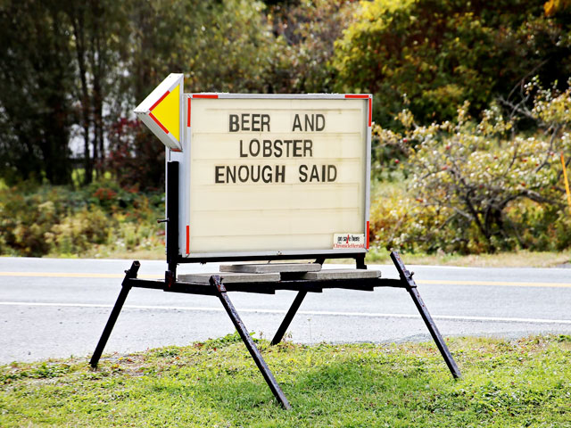 A sign that says, Beer and Lobster Enough Said