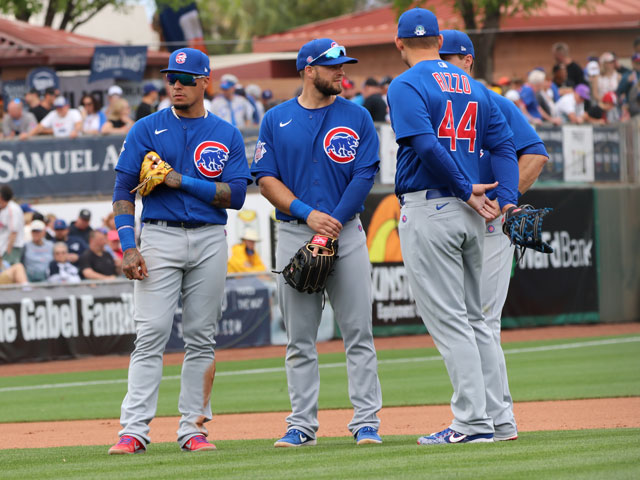 4 Chicago Cubs infielders discussing a pitching change