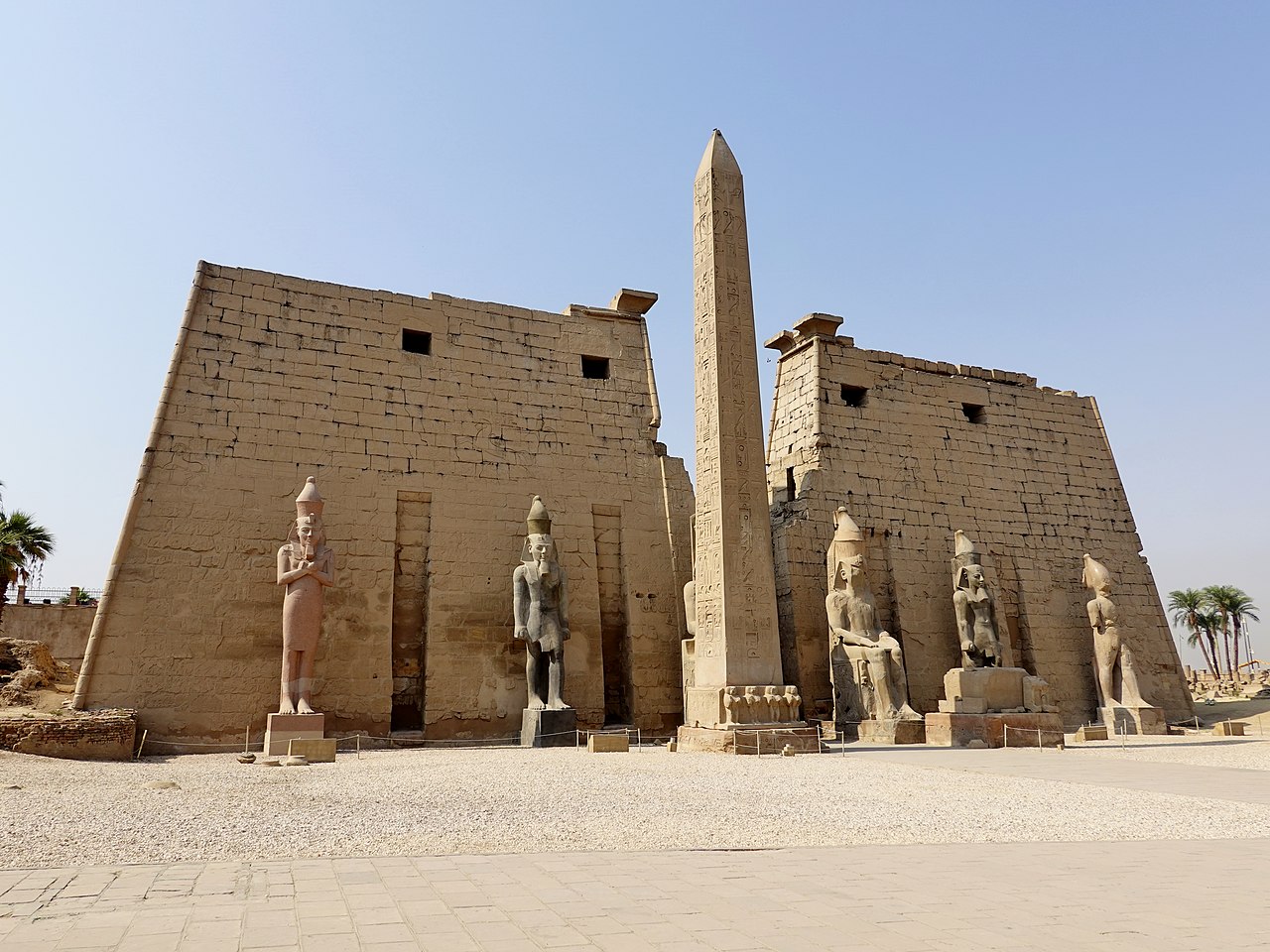 entrance to the luxor temple with massive statues