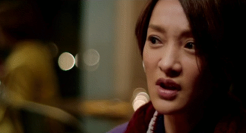 An animated gif of a scene from the movie 'Women Who Flirt' showing Angie saying 'I love/hate you' in Chinese with anger in her eyes.