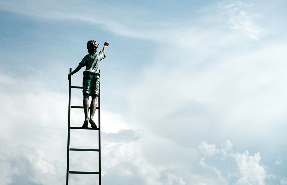 kid trying to reach the cloudy sky on a ladder