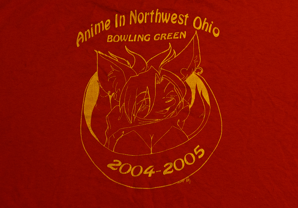 The back of the 2004 Anime In Northwest Ohio tee shirt. The front graphic is the same as the 2003 tee shirt.