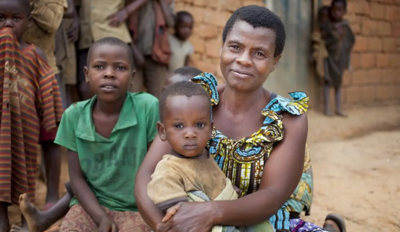 Community Health Worker Jeannette in Burundi with children.