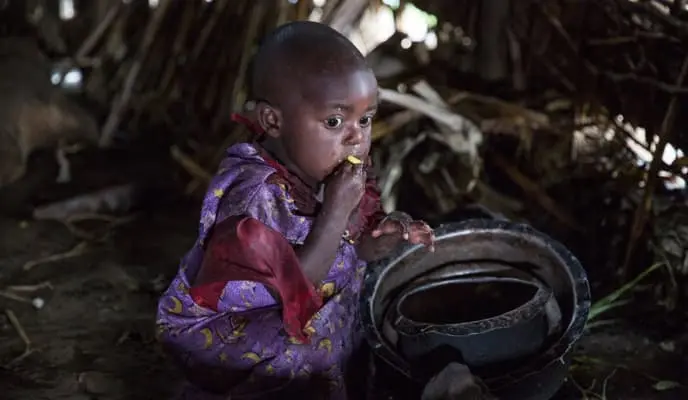 Young child eating, DRC