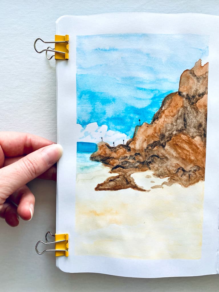 A jetty of rocks rendered in water soluable crayons