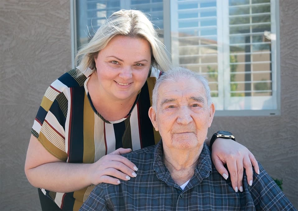 Caretaker Posing with Senior Patient