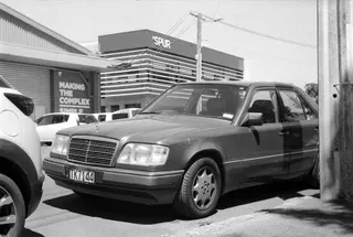 Older Mercedes car sitting in the sun