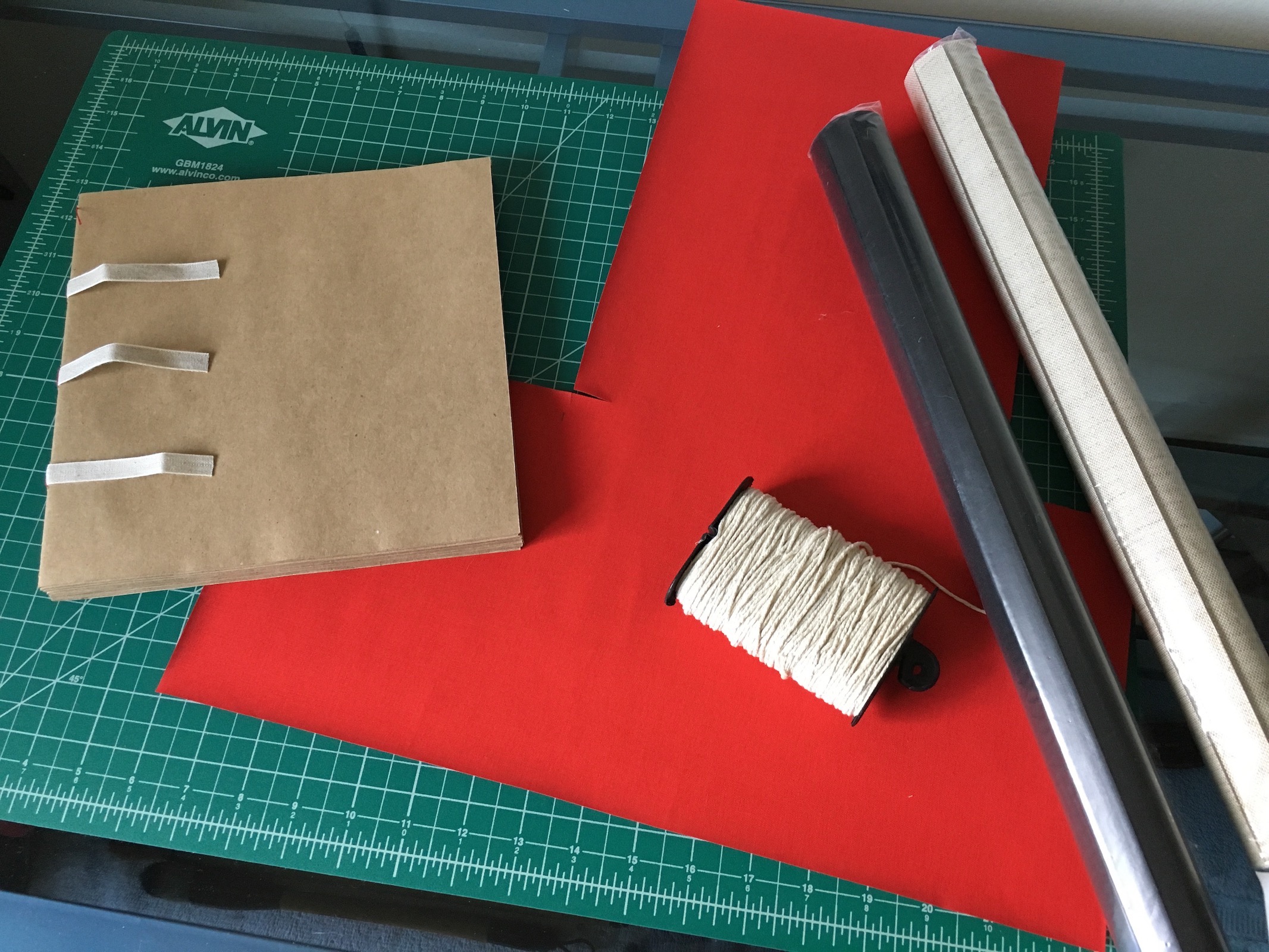 <p>I decided on black and beige cover fabric, with red bands and ribbon.</p>\n