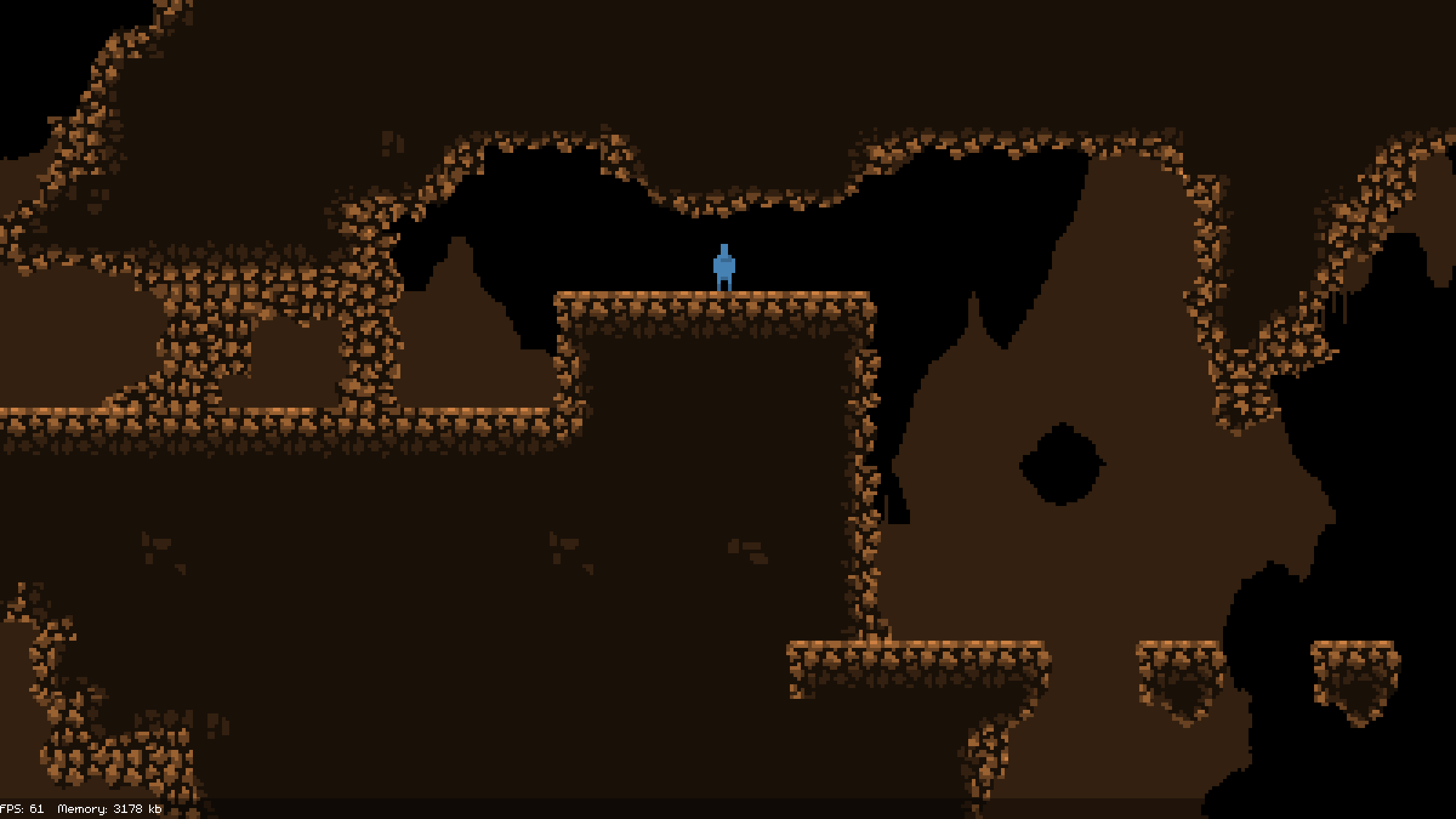 2d pixel art of a blue figure standing on a rocky outcropping inside of a cave system.