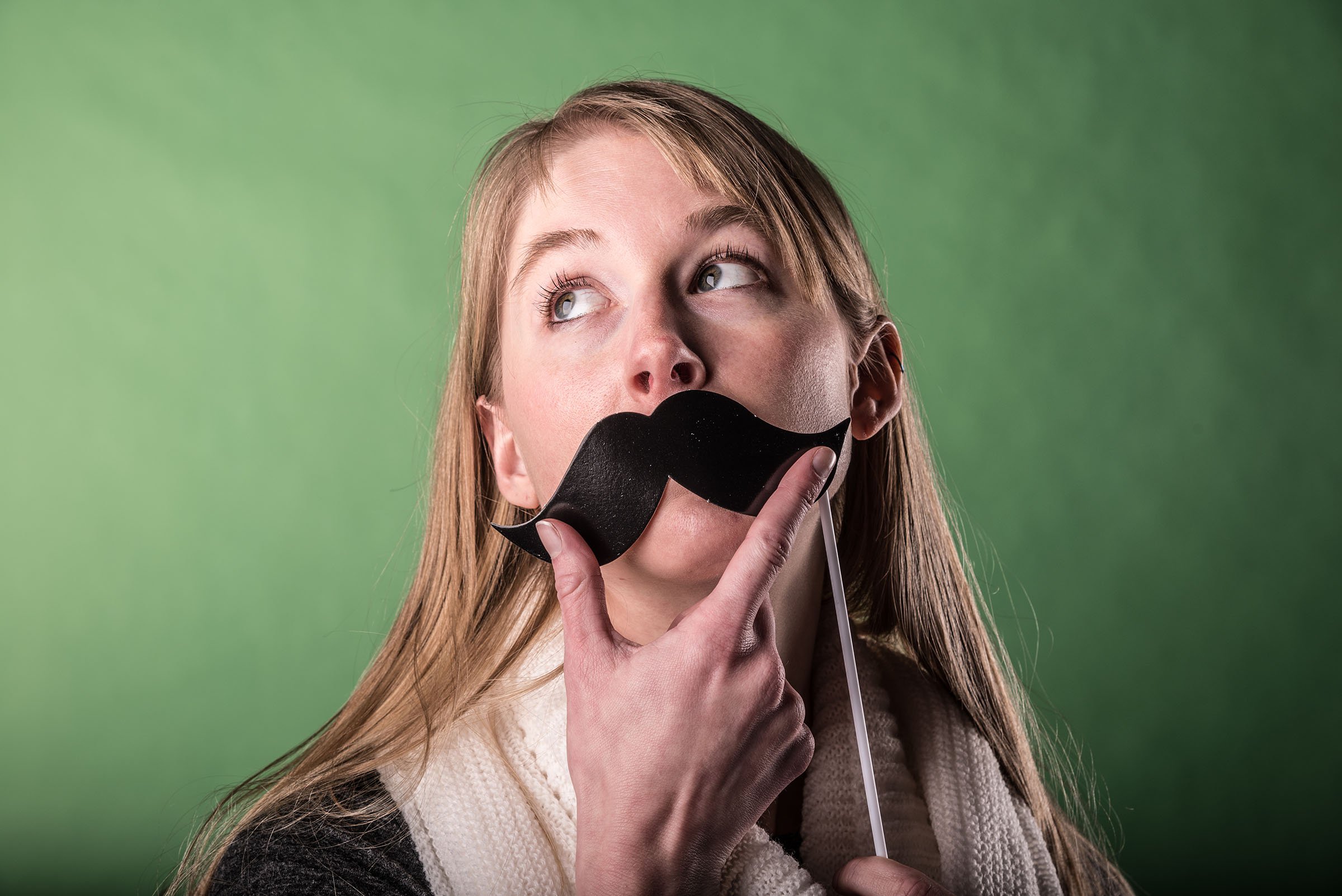 Portrait of woman wearing mustache