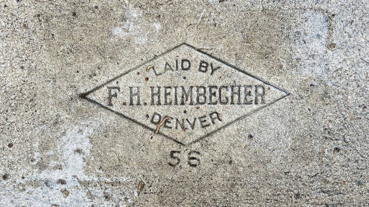 “Laid by F.H. Heimbecher, Denver, ‘56” is set in an all-caps serif, enclosed by a diamond