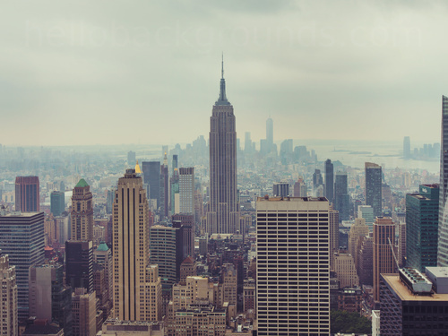 Misty New York City skyline view with Empire State Building in centre among many other tall buildings Microsoft Teams background