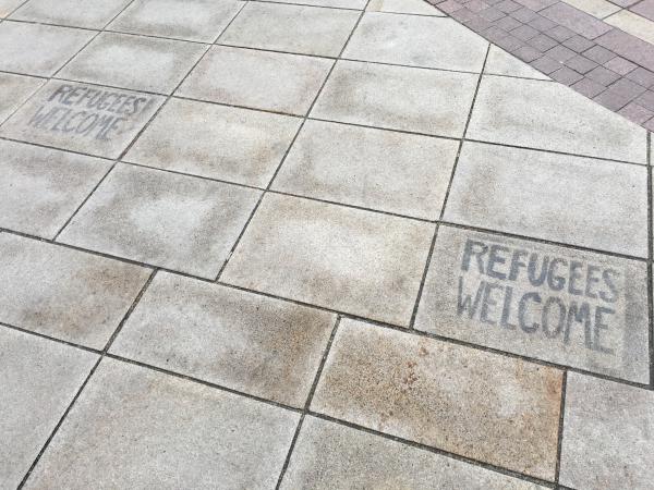 We found some graffiti with the words 'Refugees Welcome' on the floor