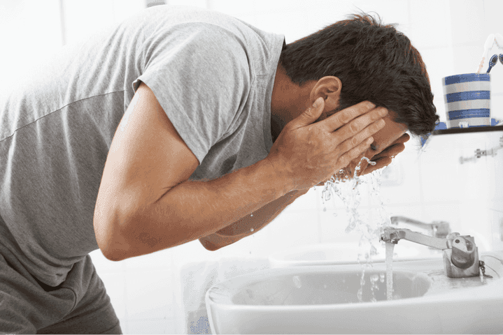 Man washing their face