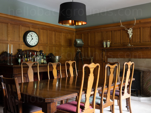 Historic style meeting room with decorative wooden wall panels along with ornate wooden table and chairs Zoom background