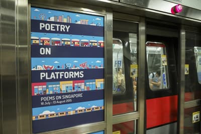 Photo of the illustrated title 'Poetry on Platforms' on a MRT door.