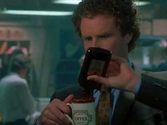 Buddy the Elf pouring booze into his coffee mug as he plays the Elf Drinking Game