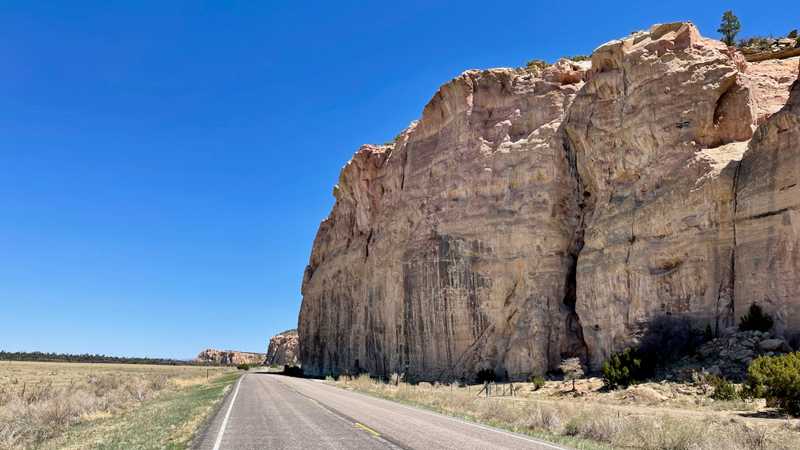 NM 117 passes a large sandstone bluff