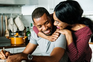 Black couple hugging together in a kitchen routine STI STD testing Nigeria