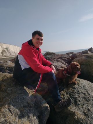Declan and his dog Bruno sat on the rocks on Rottingdean beach.
