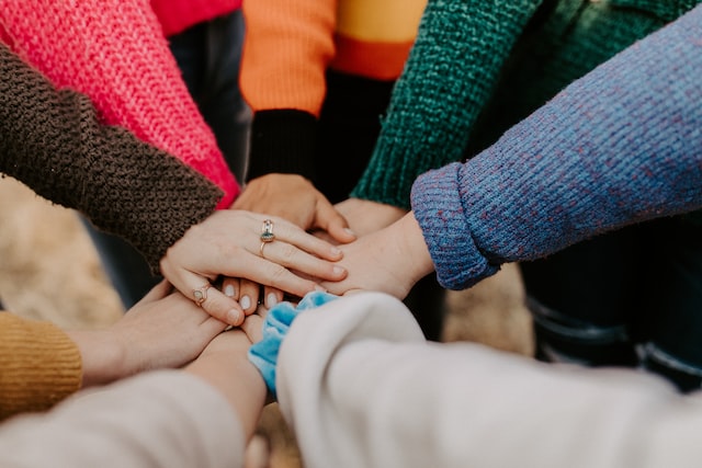 8 hands put into the center of group circle