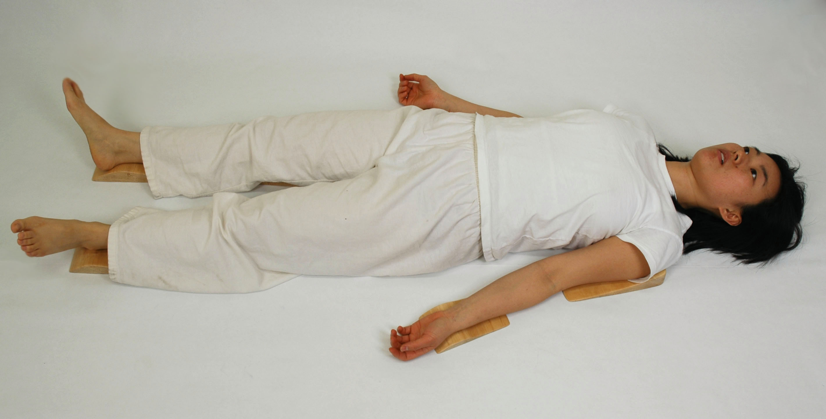 A woman lying on her back on this same "mattress"