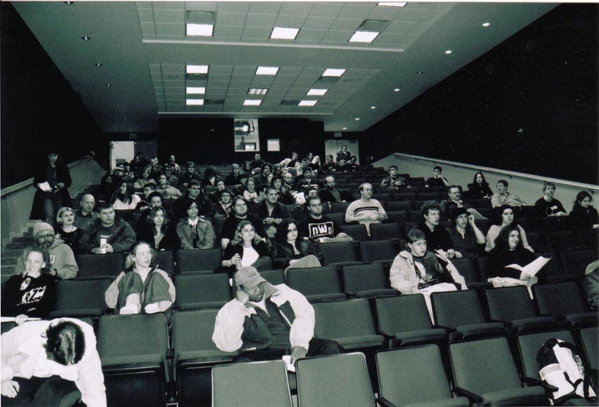 A monochorme picture of an early ANO meeting in the Bowen Thompson Student Union Theater.