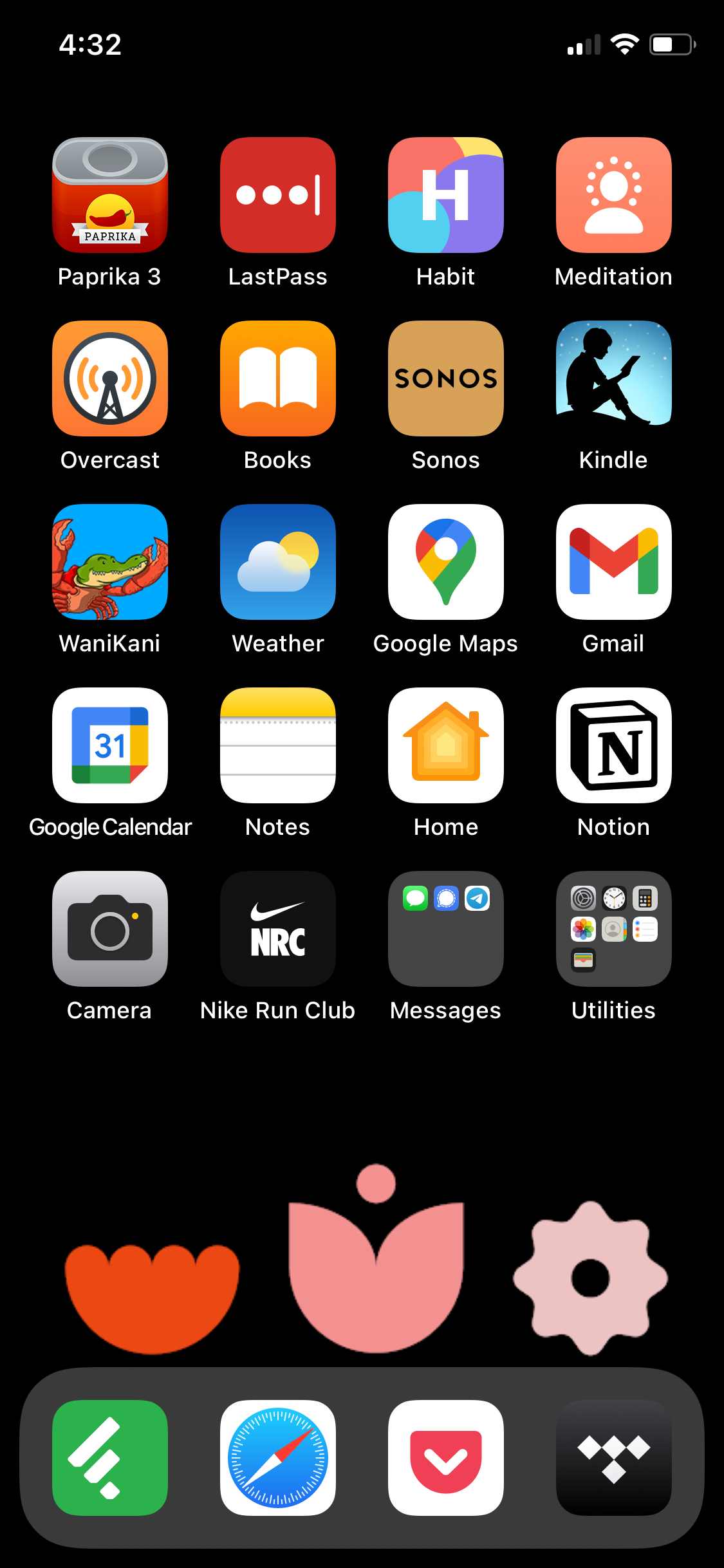A home screen showing the three geometric flowers at the bottom of the screen this time, arranged in a row such that they avoid being overlapped by any app icons