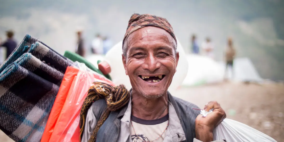 A man at an aid distribution in Nepal
