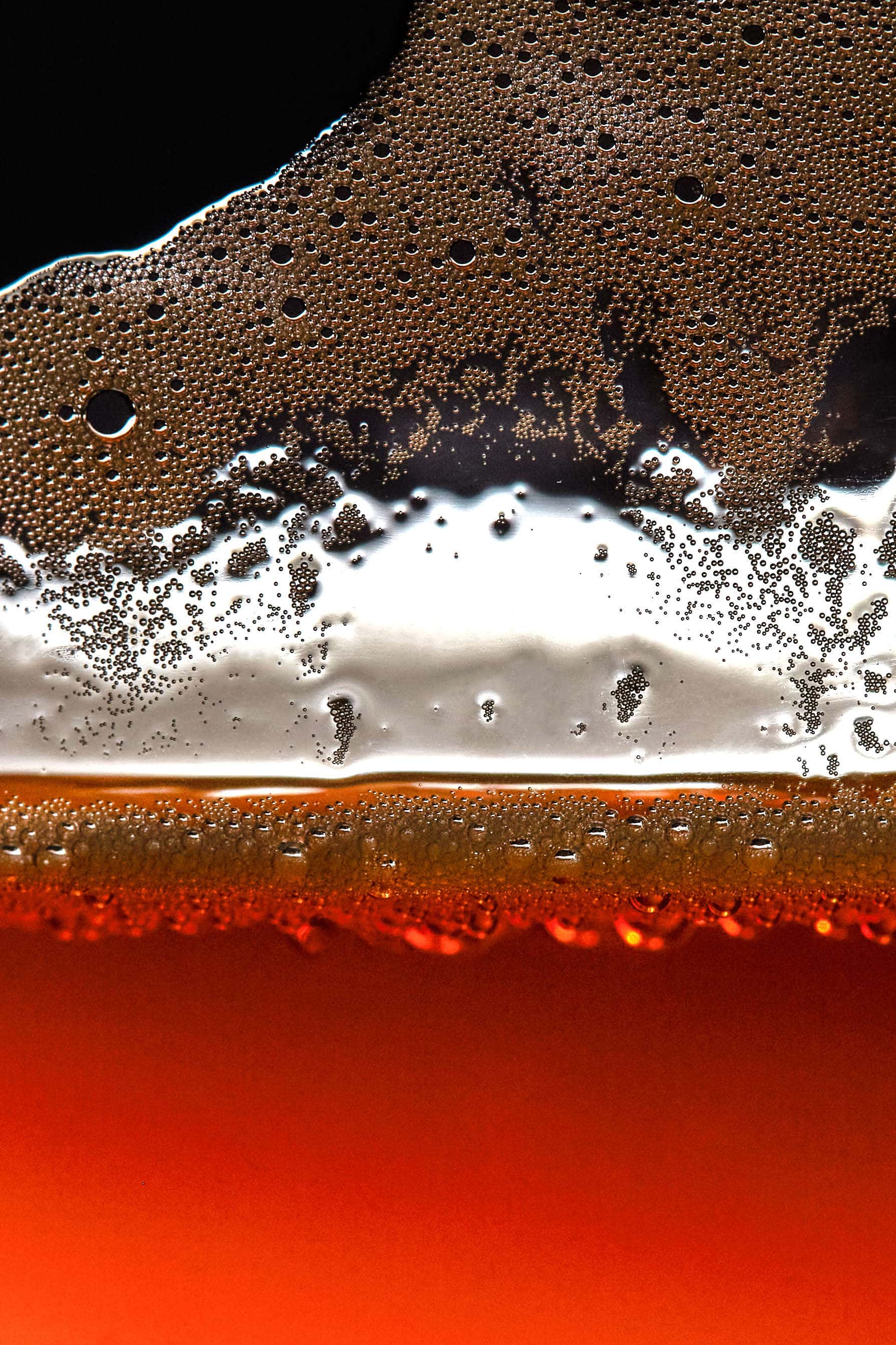 bubbles on side of glass of beer