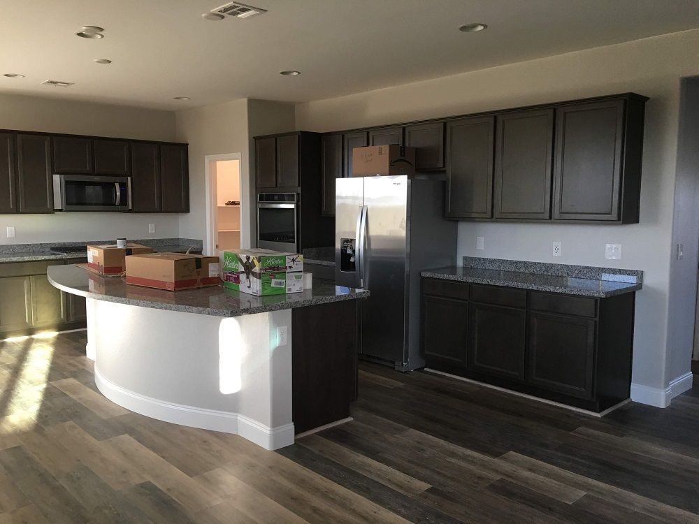 enlarged photo of newly painted modern kitchen cabinets and walls