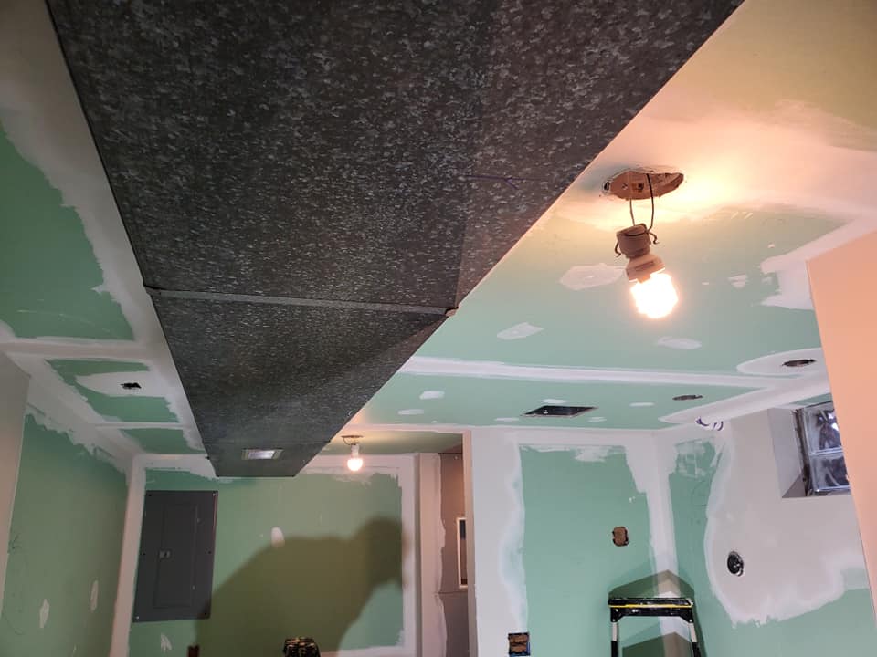 enlarged photo of before and after of a bathroom remodel