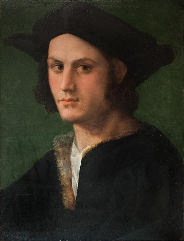 Portrait of a young man wearing hat and looking off to the side.