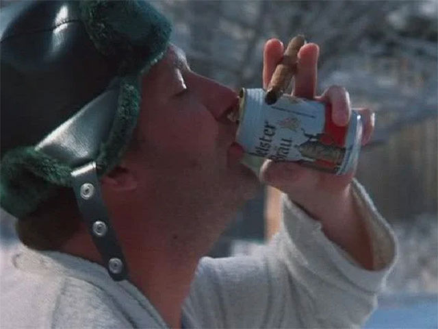 Cousin Eddie chugging a beer while playing the Christmas Vacation Drinking Game