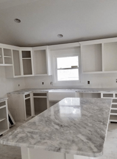 A marble kitchen countertop and island fabricated using donna sanda marble