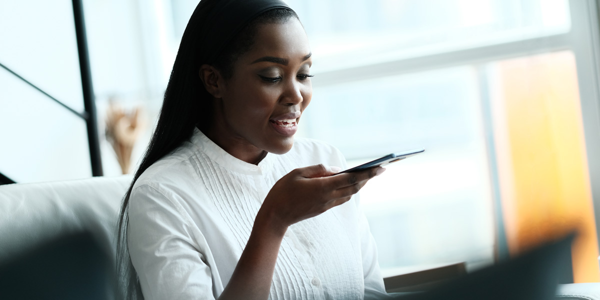 Is big data dangerous? A closer look at some of the risks associated with big data A woman sitting on a sofa, speaking into a smartphone