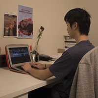 Ching Chang sitting at his desk