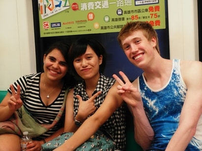 The author posing with friends on the subway in Taiwan