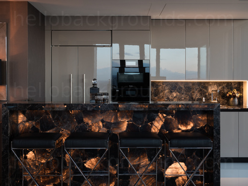 Ultra-modern kitchen adorned with marbled breakfast bar and stylish dark cream fittings Zoom background