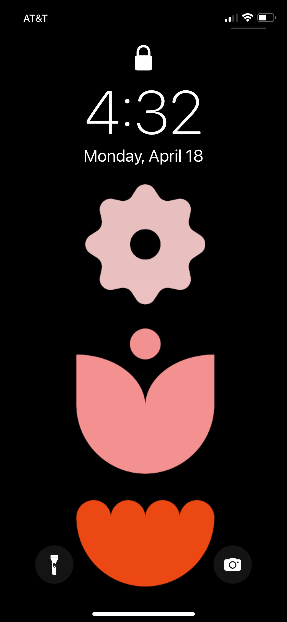 A lock screen with a black solid wallpaper. The wallpaper has three geometric flowers displayed in a column, ranging from a soft pink to a bright red. The first flower looks vaguely daisy-ish, the second like a tulip, the third maybe like a mum.